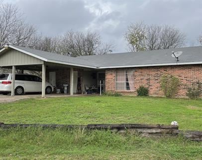 View of front of home featuring a front lawn, bri