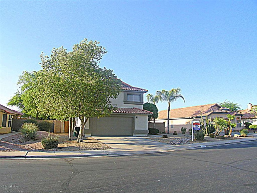 FRONT OF HOME WITH MATURE LANDSCAPE