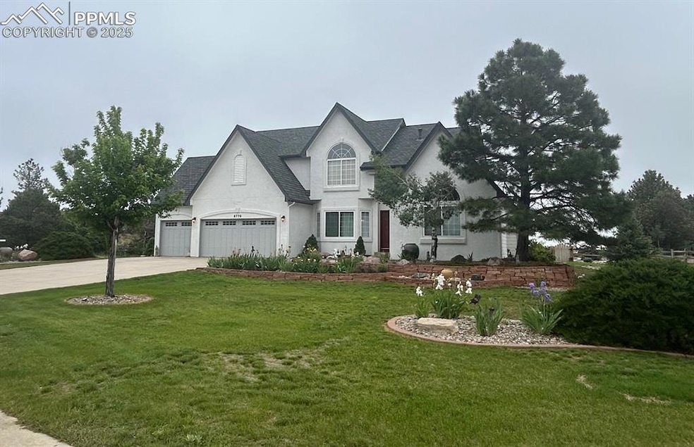 French provincial home with concrete driveway, a front lawn, stucco siding, and roof with shingles