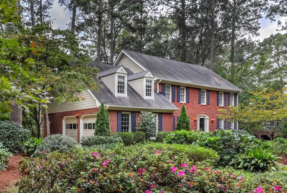 Freshly painted exterior, wooded mature lawn, and 