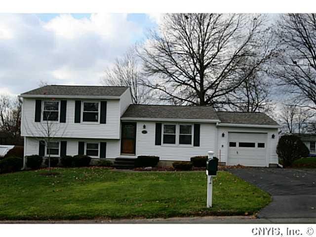 Exterior Front. New Comfort siding, replacement wi
