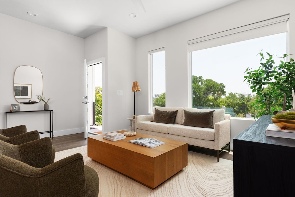 Living room with light wood-style floors, plenty 