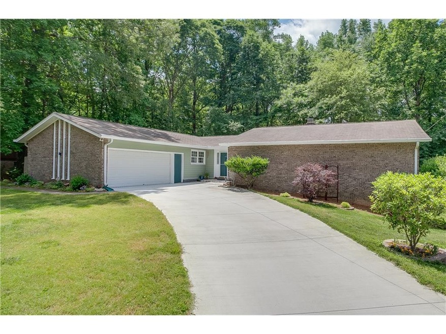 This gorgeous level front yard has well maintained landscaping creating an adorable curb appeal!