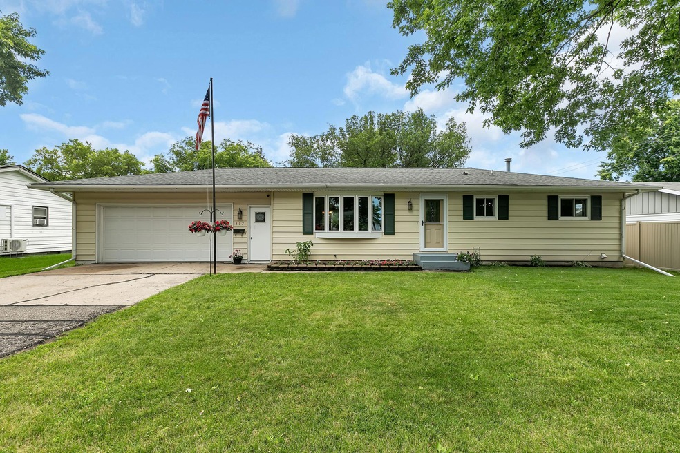 Beautiful home with attached 2 stall garage, architectural shingles and seamless rain gutters on the front of the home.