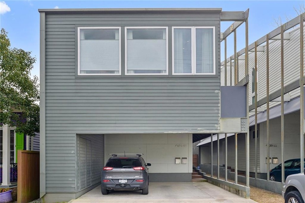 Exterior of condo with covered parking.