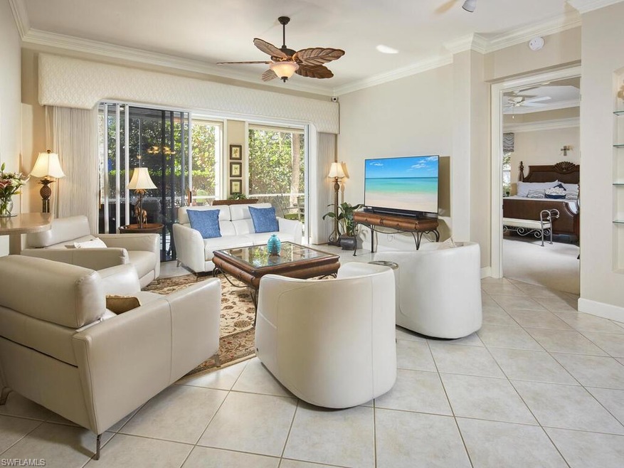 Large living room open to dining, custom bar with 