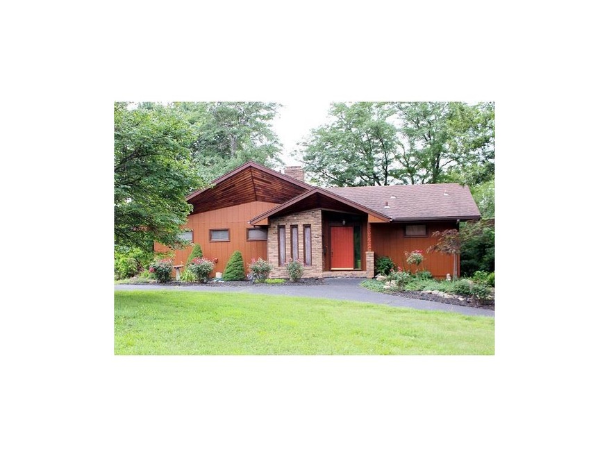 Front of Home with Circle Drive with Immaculate Landscaping!