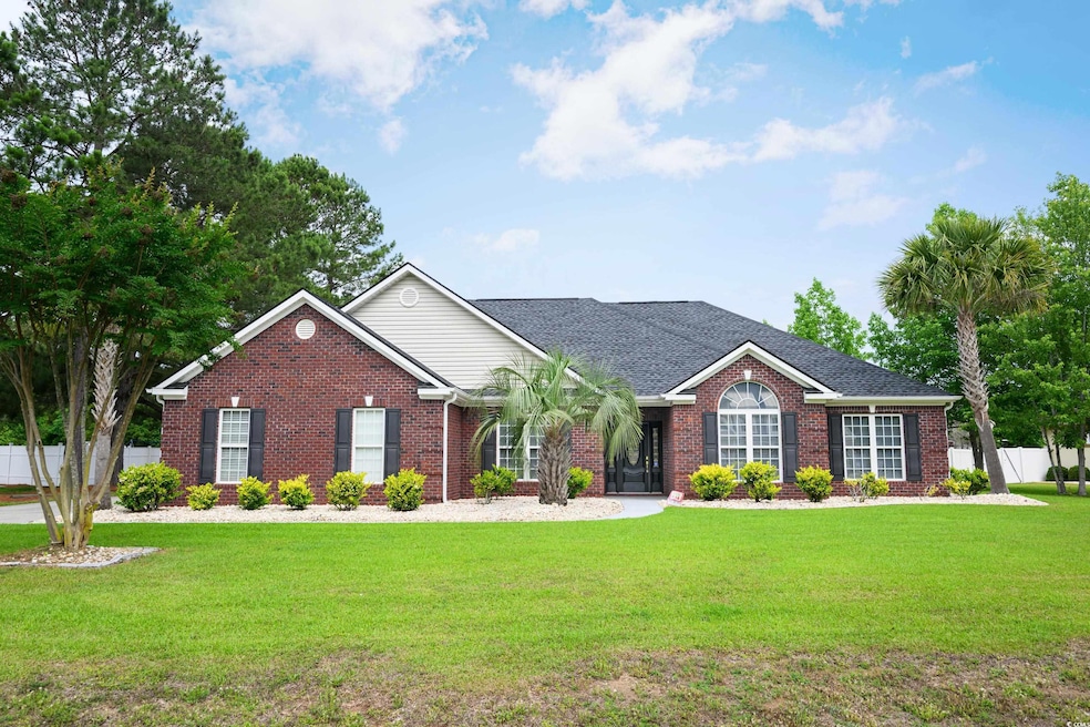 Ranch-style house with brick siding