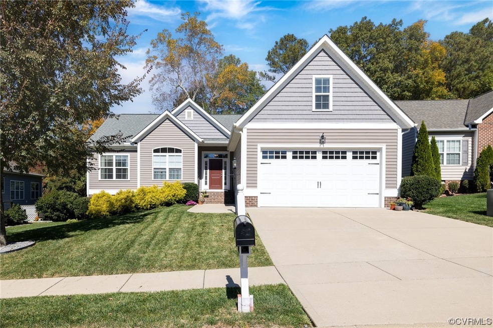 View of front of house with a garage and a front l