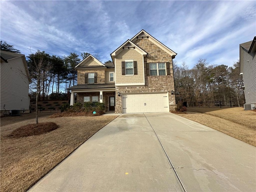 Craftsman-style home with a garage and central AC 