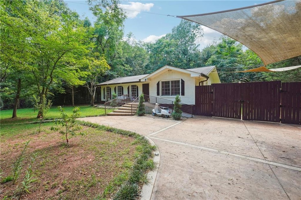 Single story home featuring a gate