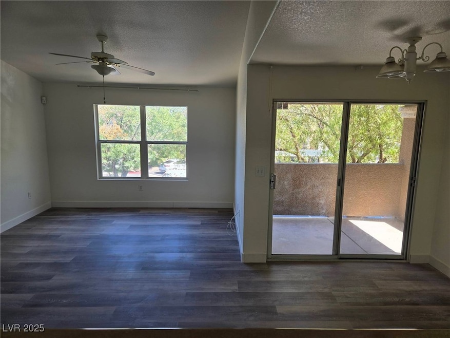Unfurnished room featuring dark wood-type flooring