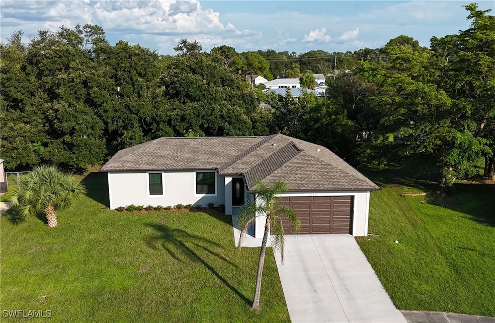Ranch-style house with an attached garage, a front