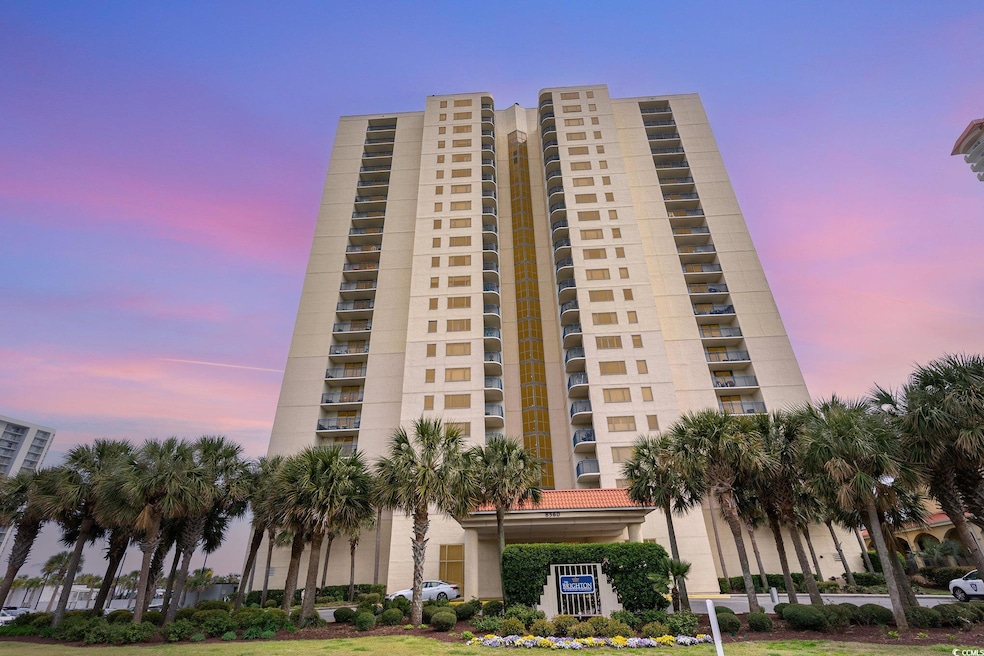 View of property at dusk