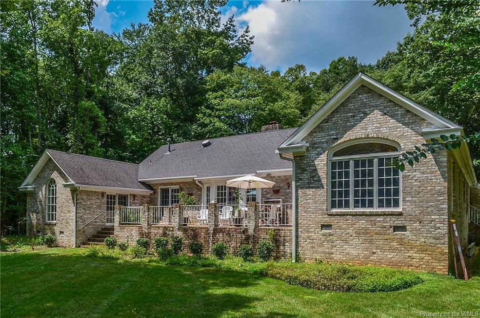 Big raised brick patio overlooks water and golf