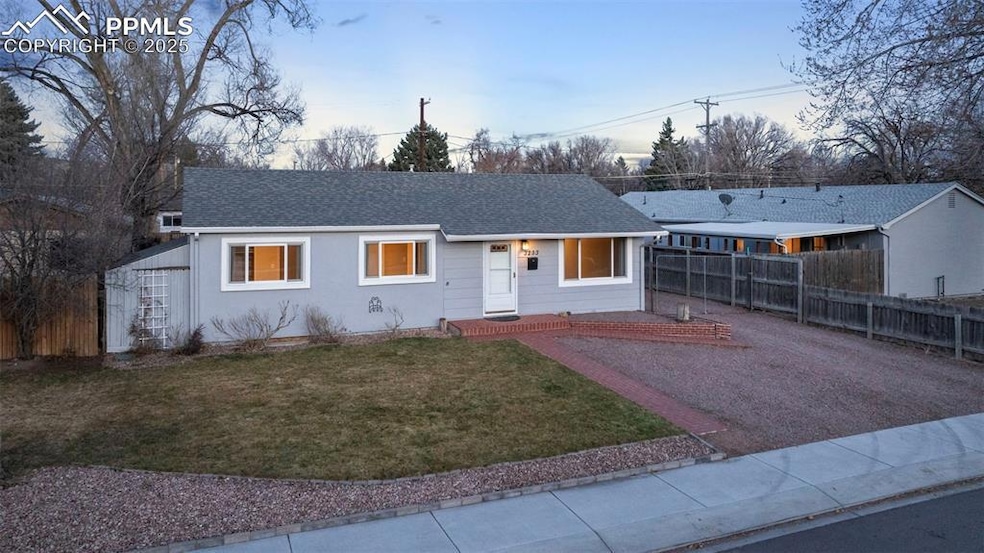 Ranch-style house at twilight featuring upgraded s