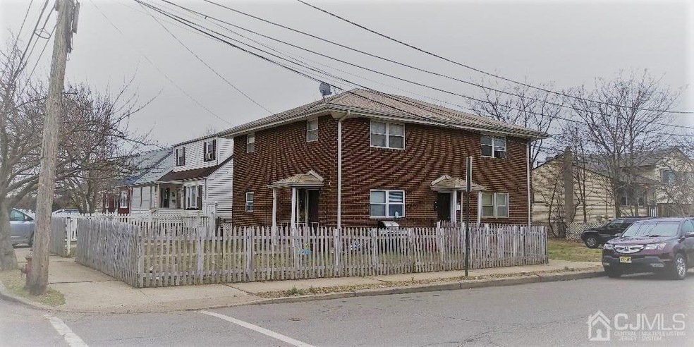 Corner view of property with 2 entrances. The fenc