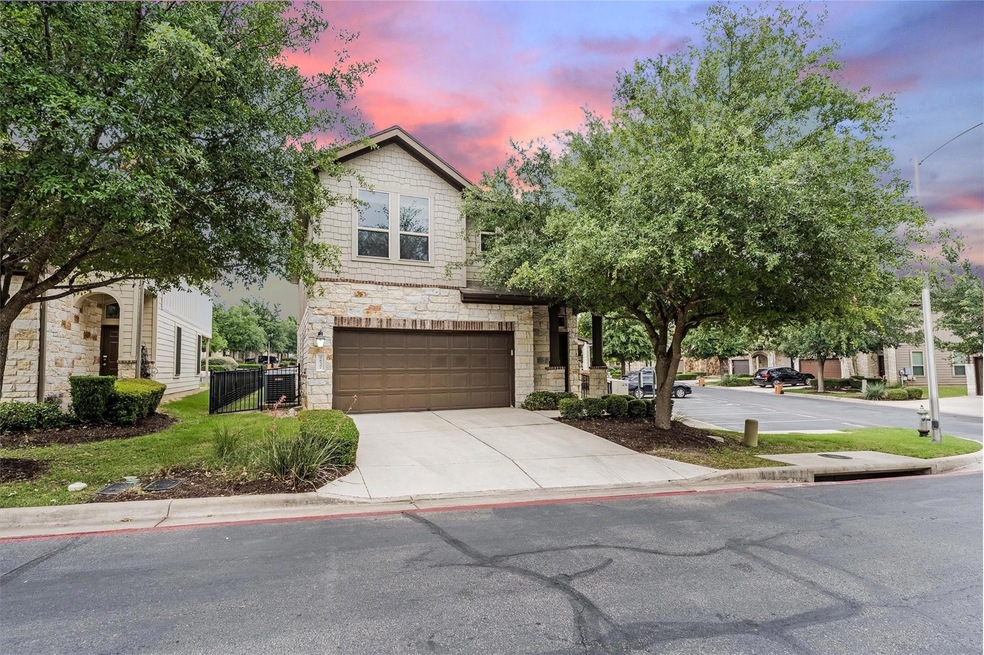 View of front of home with an attached garage, st