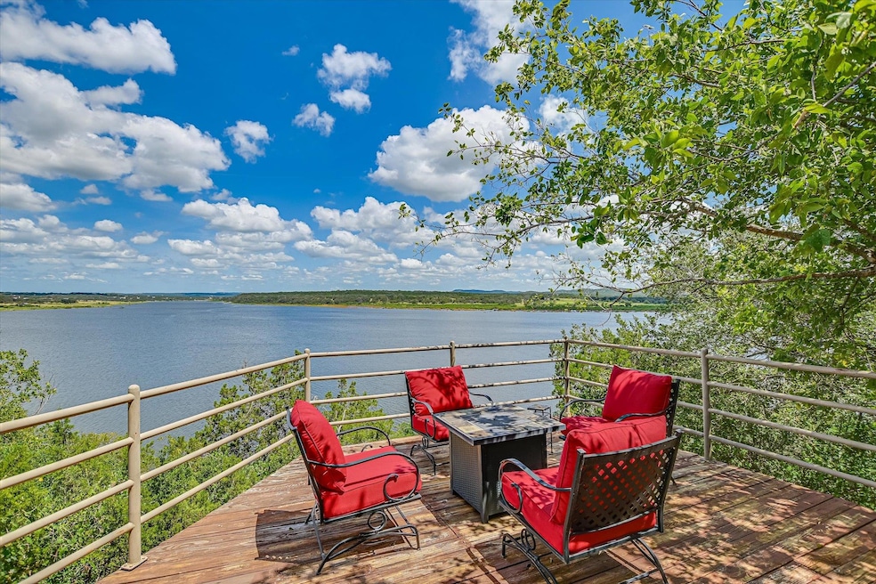 Welcome to 102 Center Cove I on Lake Travis where PANORAMIC Views and Direct Lake Access await.
