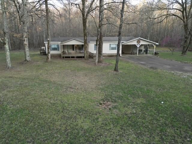 View of front of home featuring a detached carport