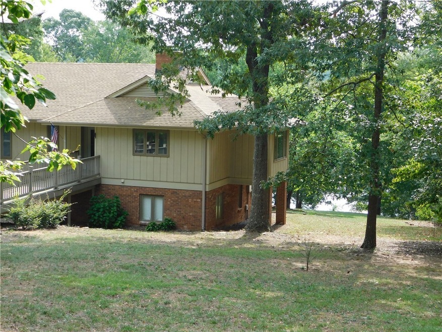 Spacious yard with solid brick & wood exterior