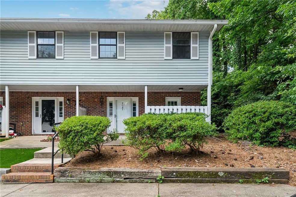 End Unit Townhome with covered porch and brick & siding