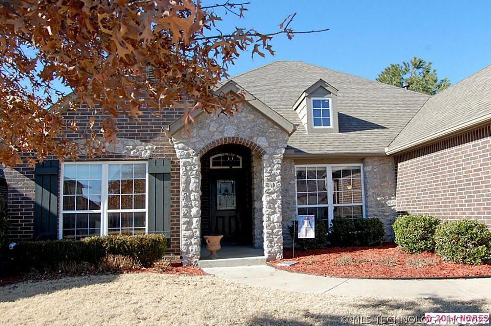 Full brick and stone one story with superb curb ap