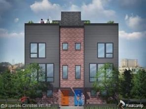 Rear view of property featuring a fenced front yard