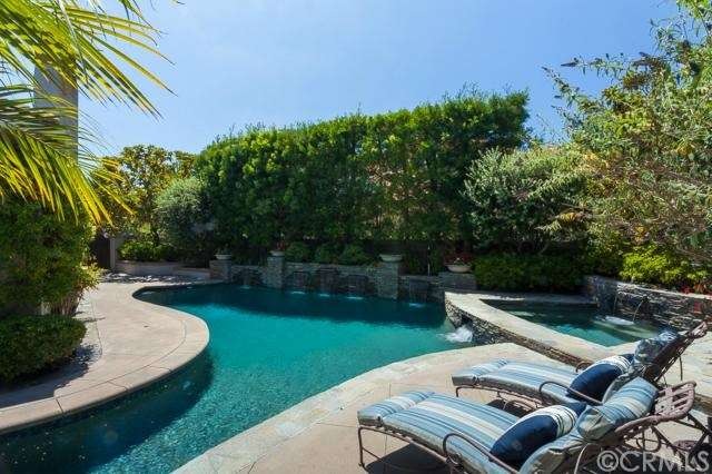 Gorgeous wrap around pool and spa with cascading w