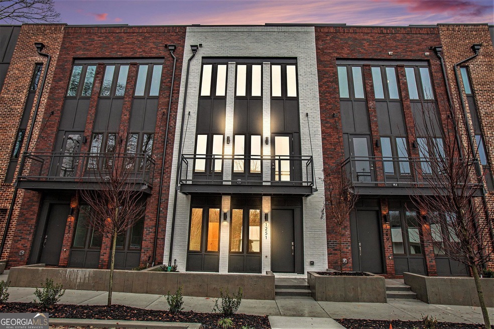 View of front of house featuring a balcony