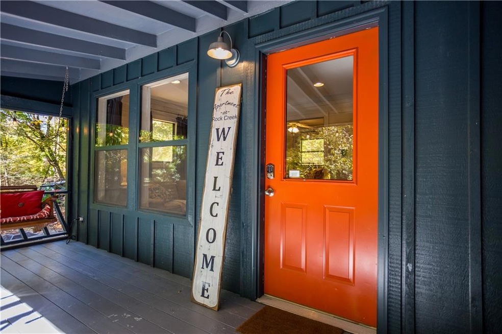 Doorway to property featuring a porch and board an