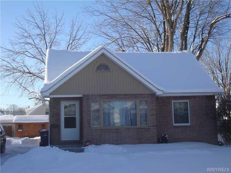 Exterior Front. Over sized Concrete driveway.  Gre