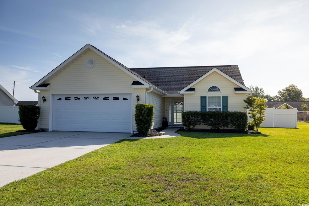 Ranch-style home with a garage and a front yard