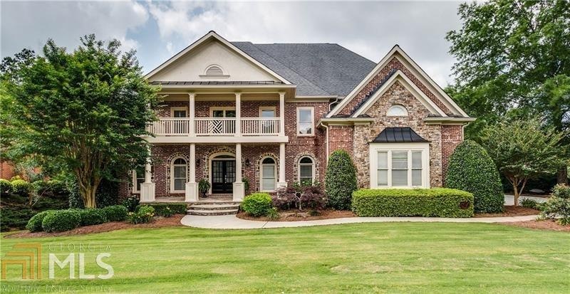 Four sided brick home featuring 6 bedrooms, 5 bath