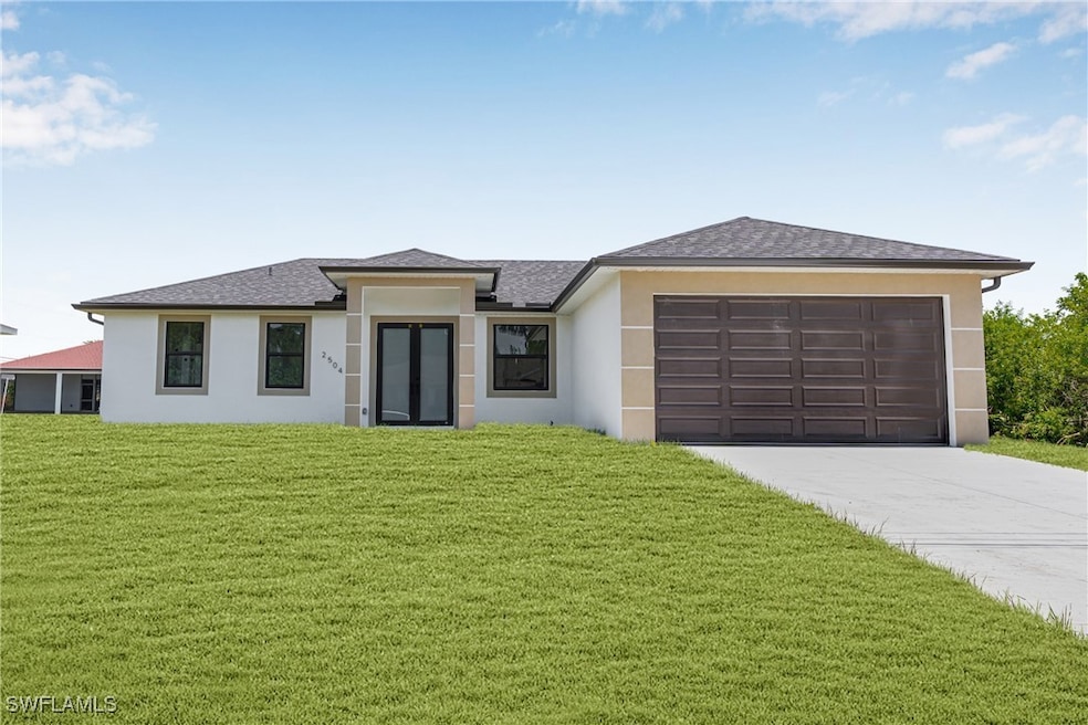 Prairie-style house with stucco siding, driveway,