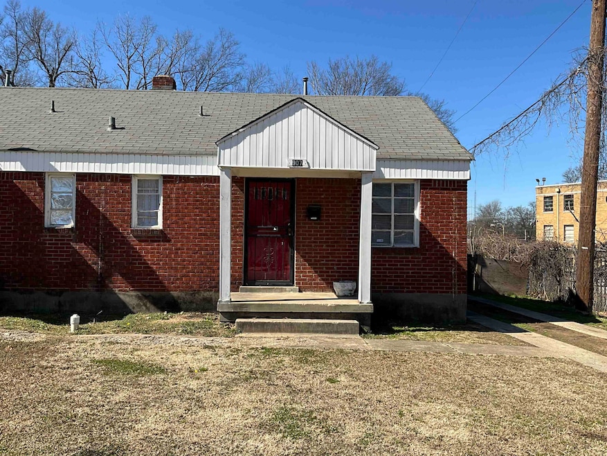 Bungalow-style home featuring a shingled roof, a c