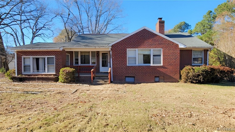 Ranch-style house featuring a front lawn