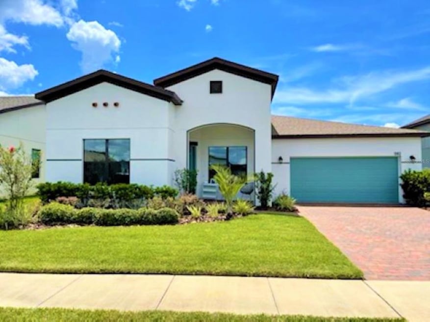 Front Exterior w/ a Modern Mediterranean look