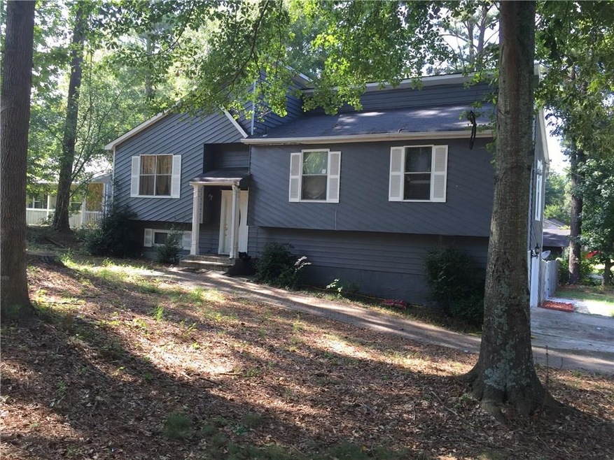 Front view of home. Apartment entrance on the side