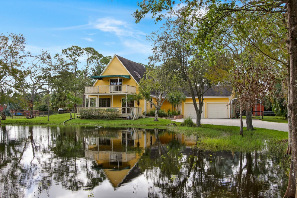 Front View of Home with Pond