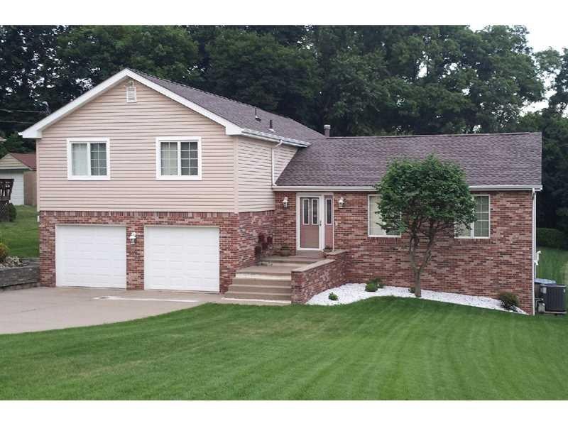 Exterior Front. Wide concrete driveway, brand new 