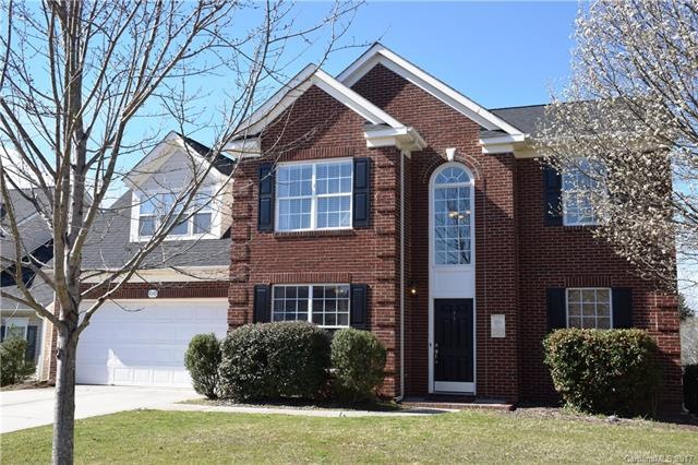 This lovely 2-story with brick front is situated o
