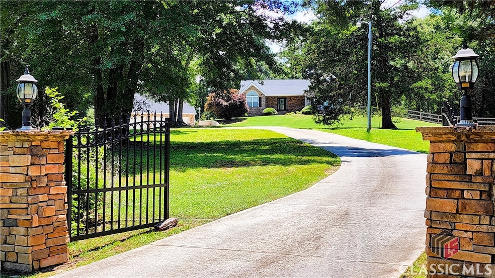 Entrance to Property with Automatic Gate. Property