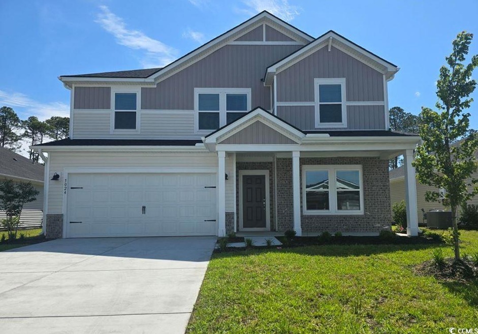 View of front facade featuring an attached garage,