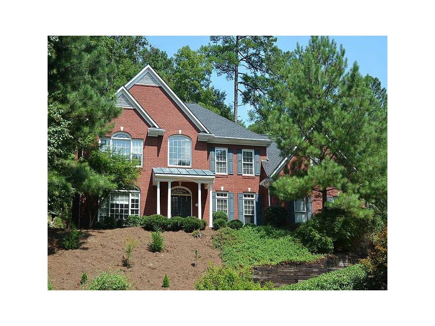 Exterior Front. Sought after 3-sided brick with ha