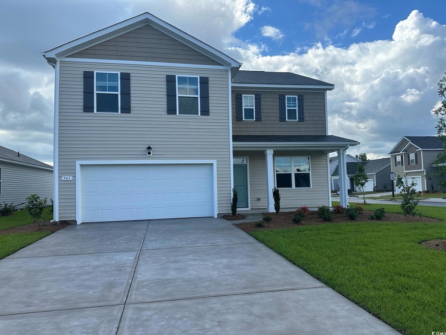 View of front property featuring a garage, a front