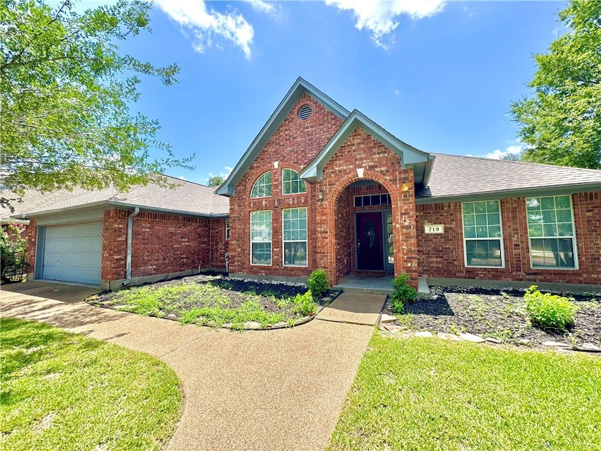 Single story home featuring brick siding, concrete