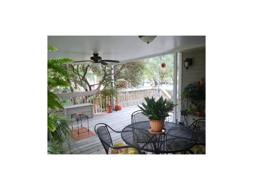 Oversized covered deck with ceiling fan is a tranq