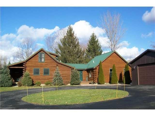 Front of home, circular blacktop driveway
