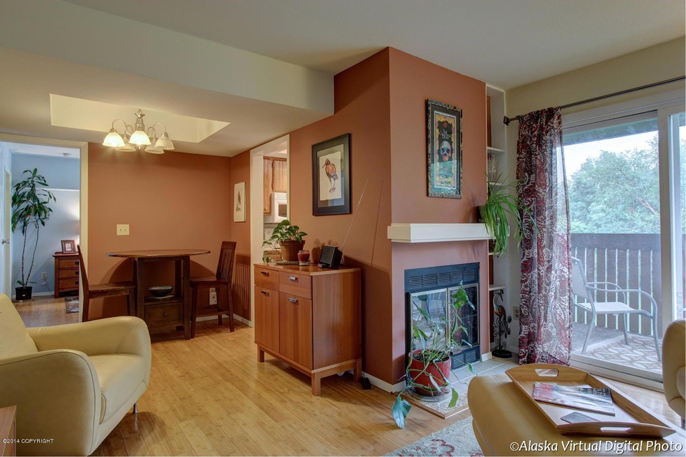 Living/Dining Area w/fireplace & deck